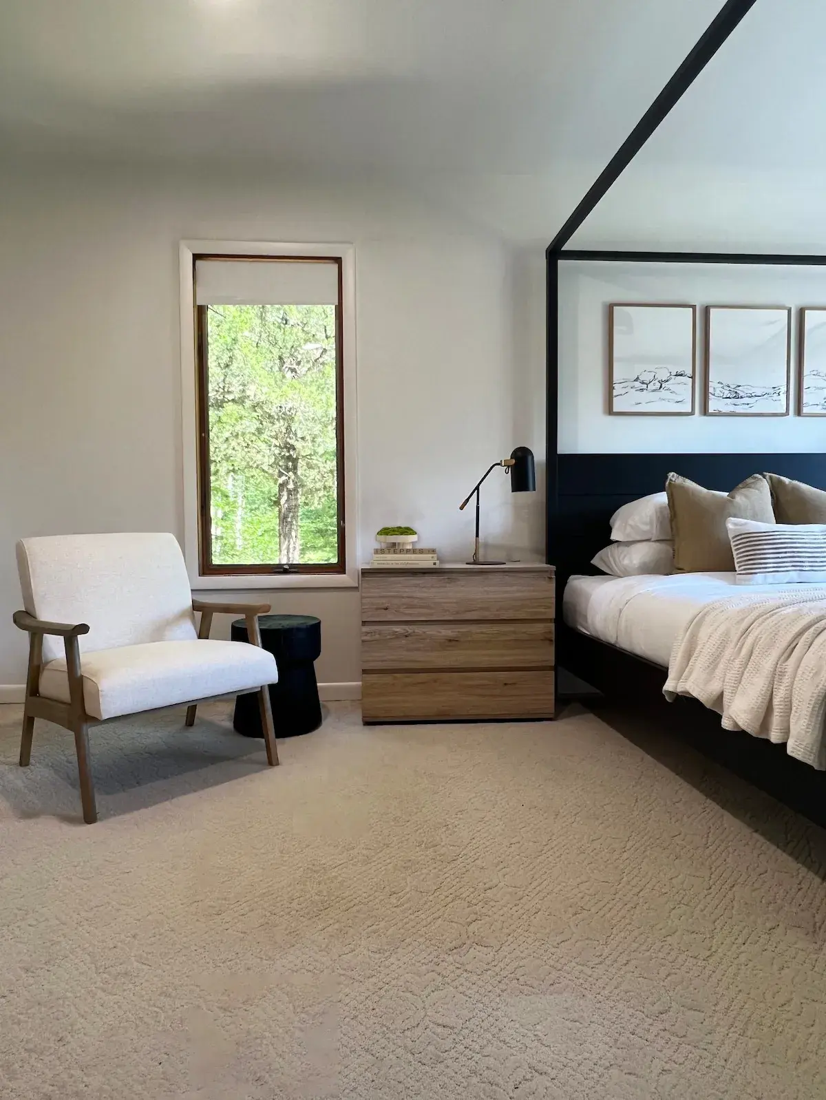 The primary bedroom, a reading chair by the window