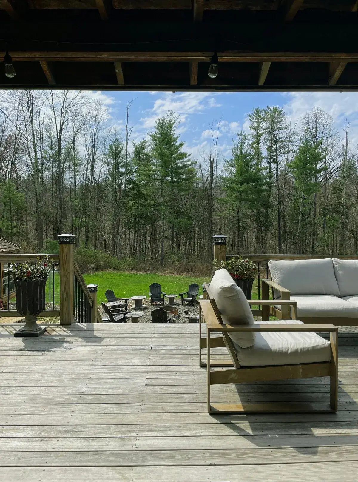 Lounge chairs on the deck, the lawn beyond