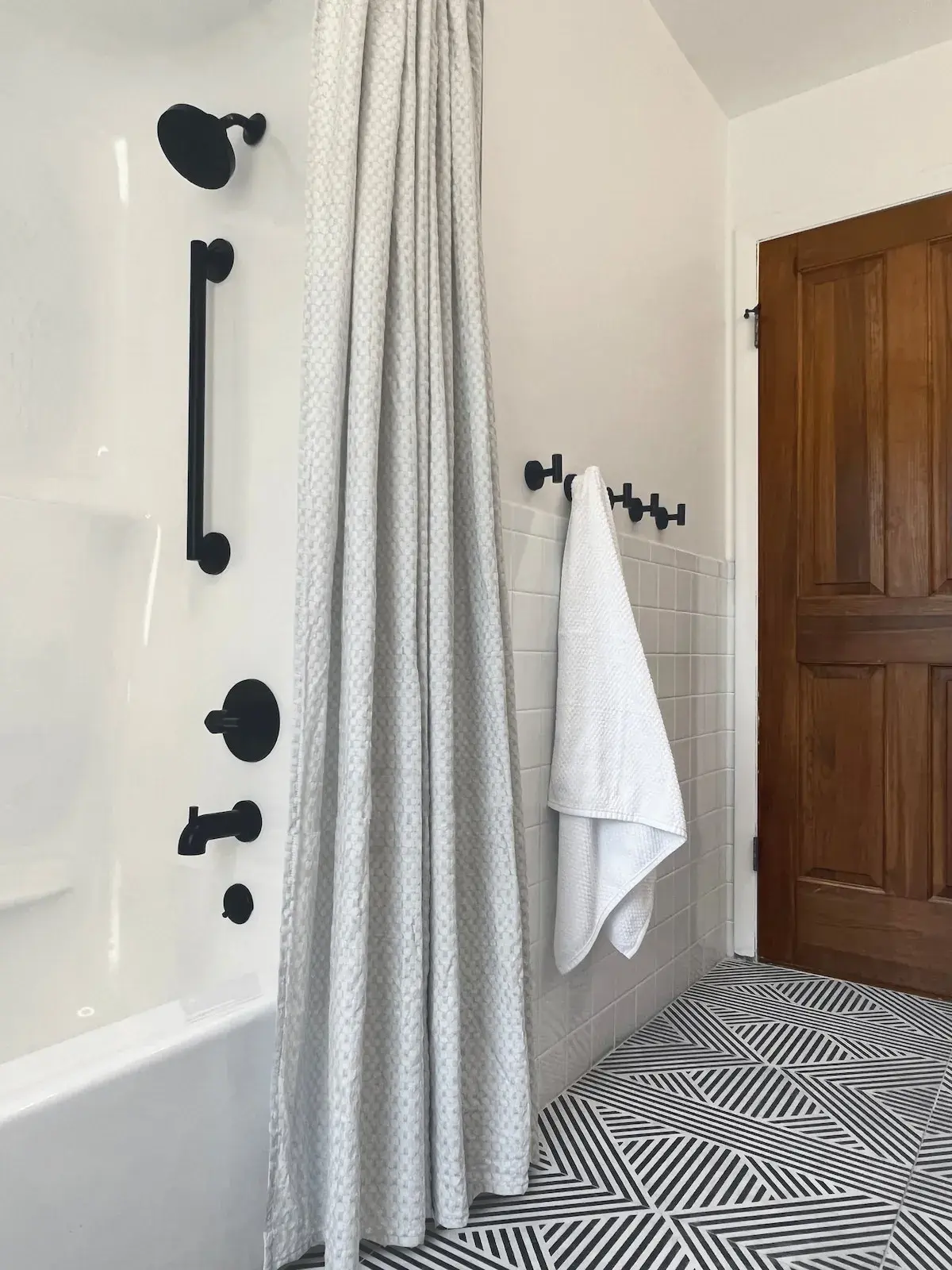 The second-floor bathroom, tub and shower