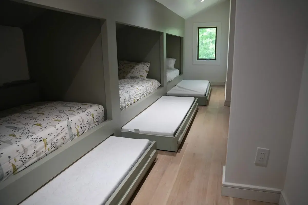 Bedroom 5 at The Acrewoods, single beds built into nooks along both walls
