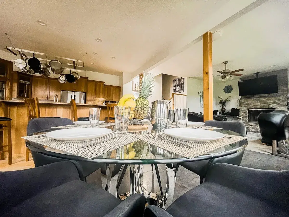 A glass dining table off the kitchen