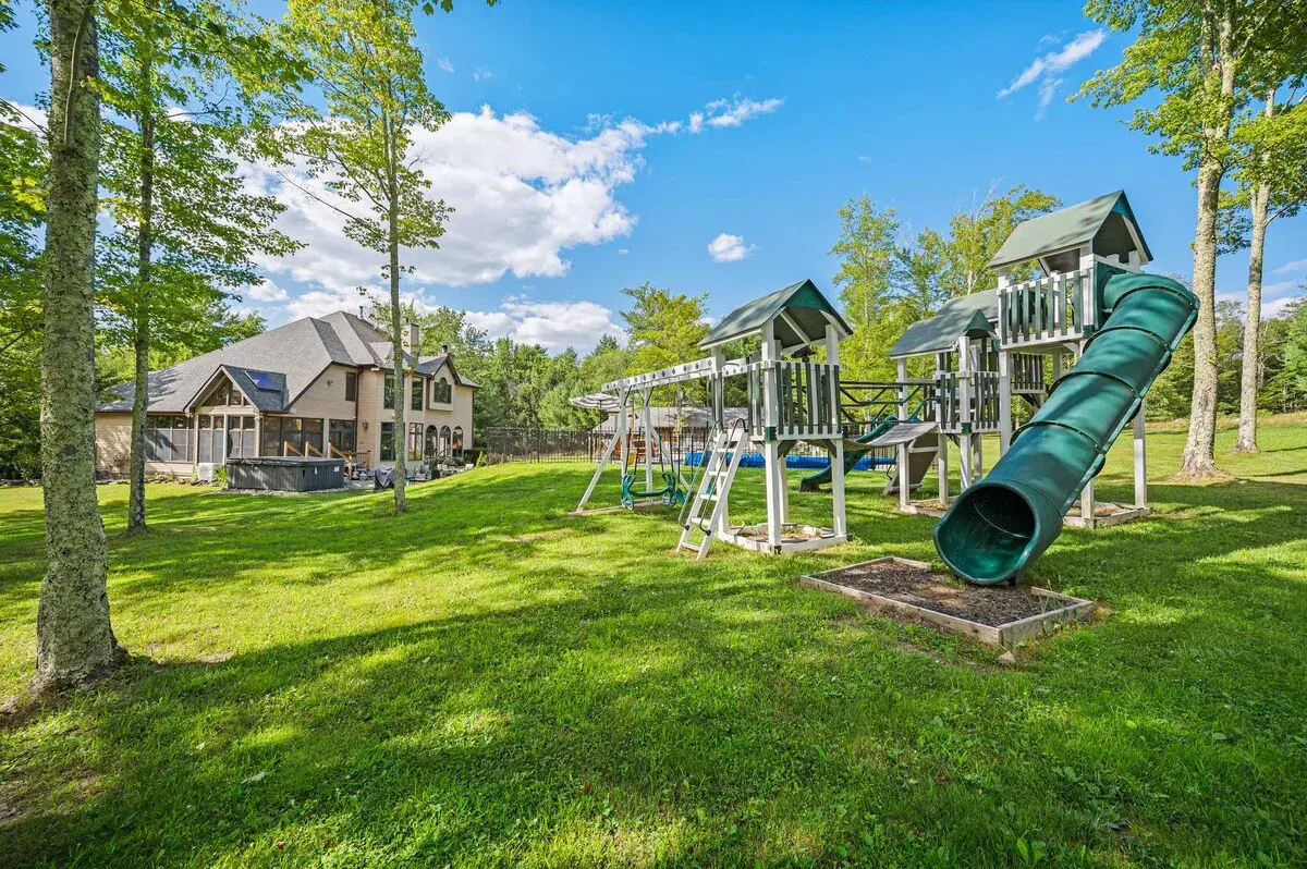 The playground on the lawn, the house behind