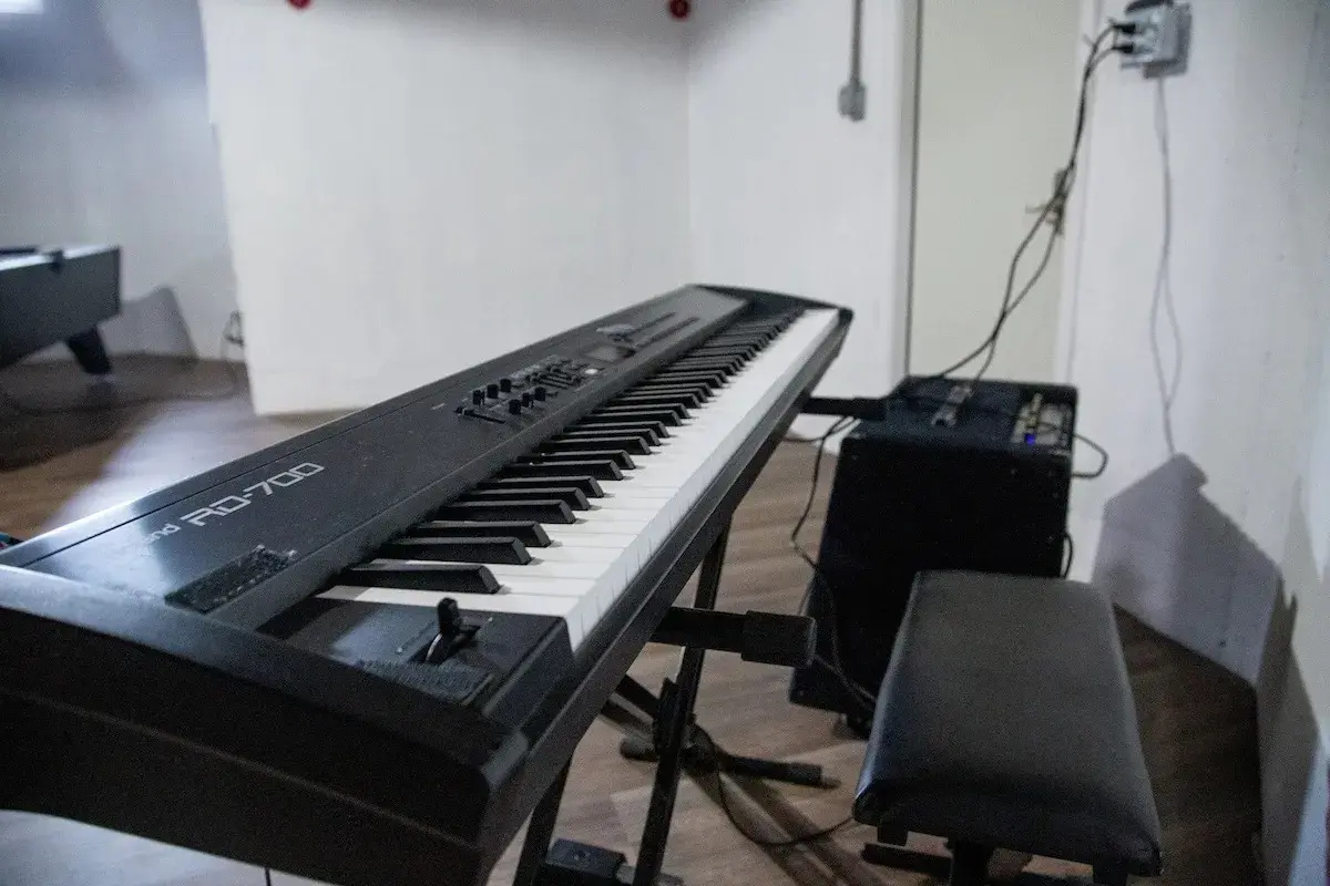 A digital piano in the game room