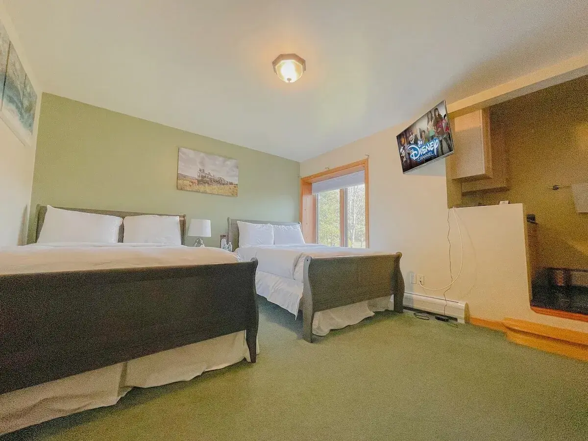 A bedroom with two beds