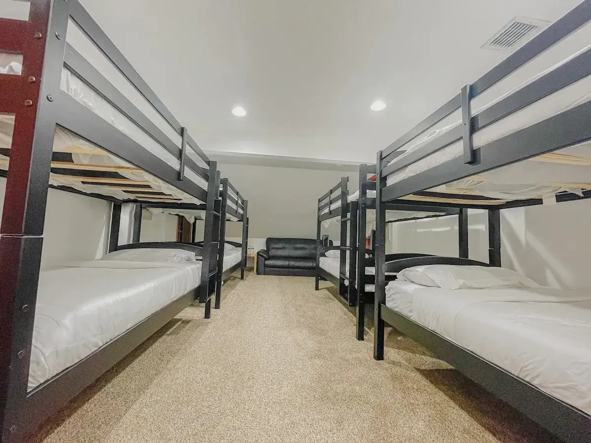 Bedroom 6 at The Birch Estate, a bunk room with four bunk beds