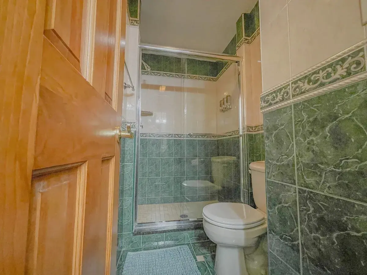 A bathroom with a glass shower