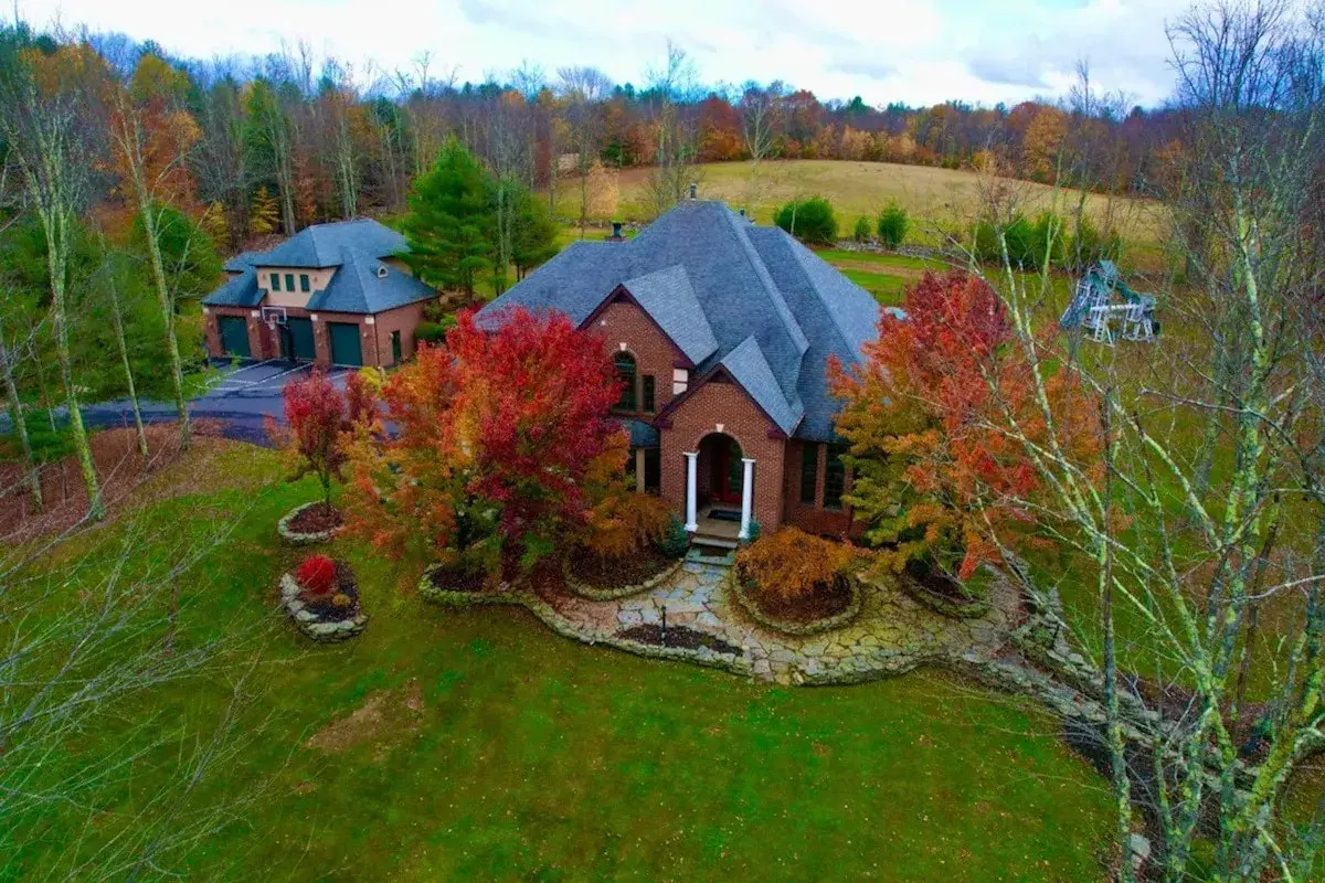 The Birch Estate from the air in autumn, the houses among the trees