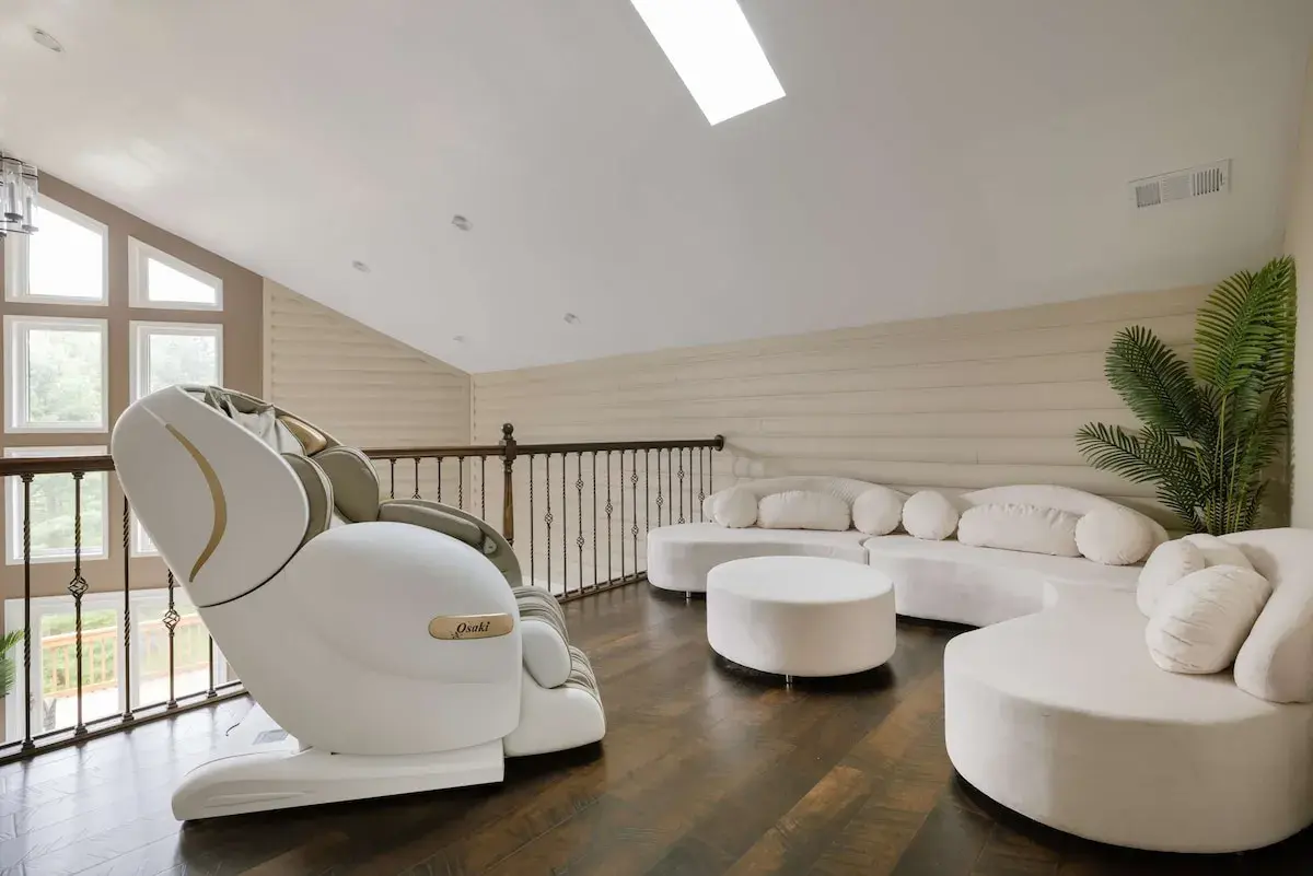 The loft: a massage chair and a curved sofa