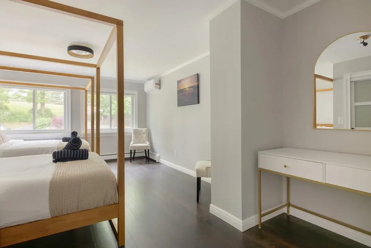 The canopy bedroom, a vanity by the window
