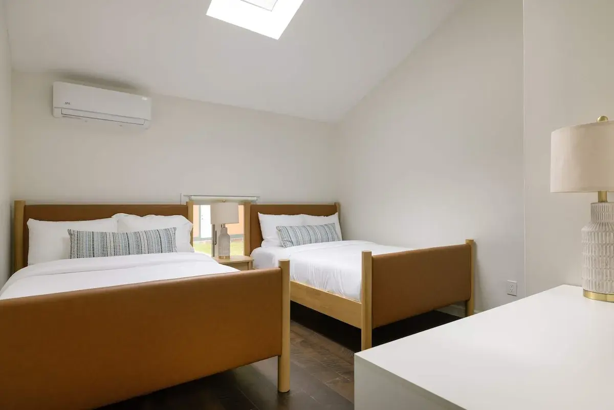 A bedroom with two beds